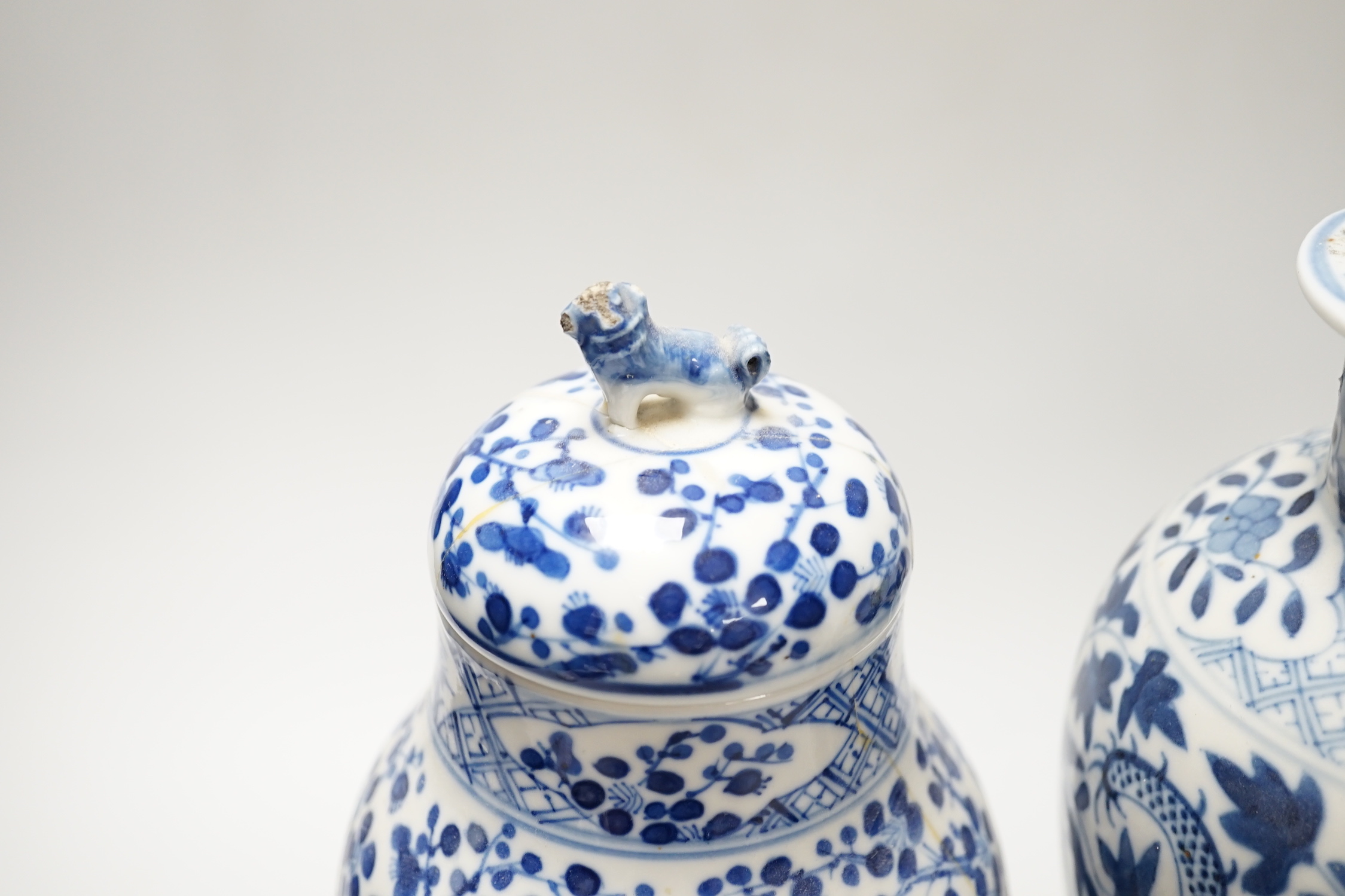 A Chinese blue and white ‘dragon’ vase and cover, and another, tallest 32cm; some damage